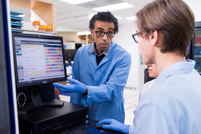 Lead Researcher Dr. Ahmed Siah explains analytical results to NIC student Chayton Skye