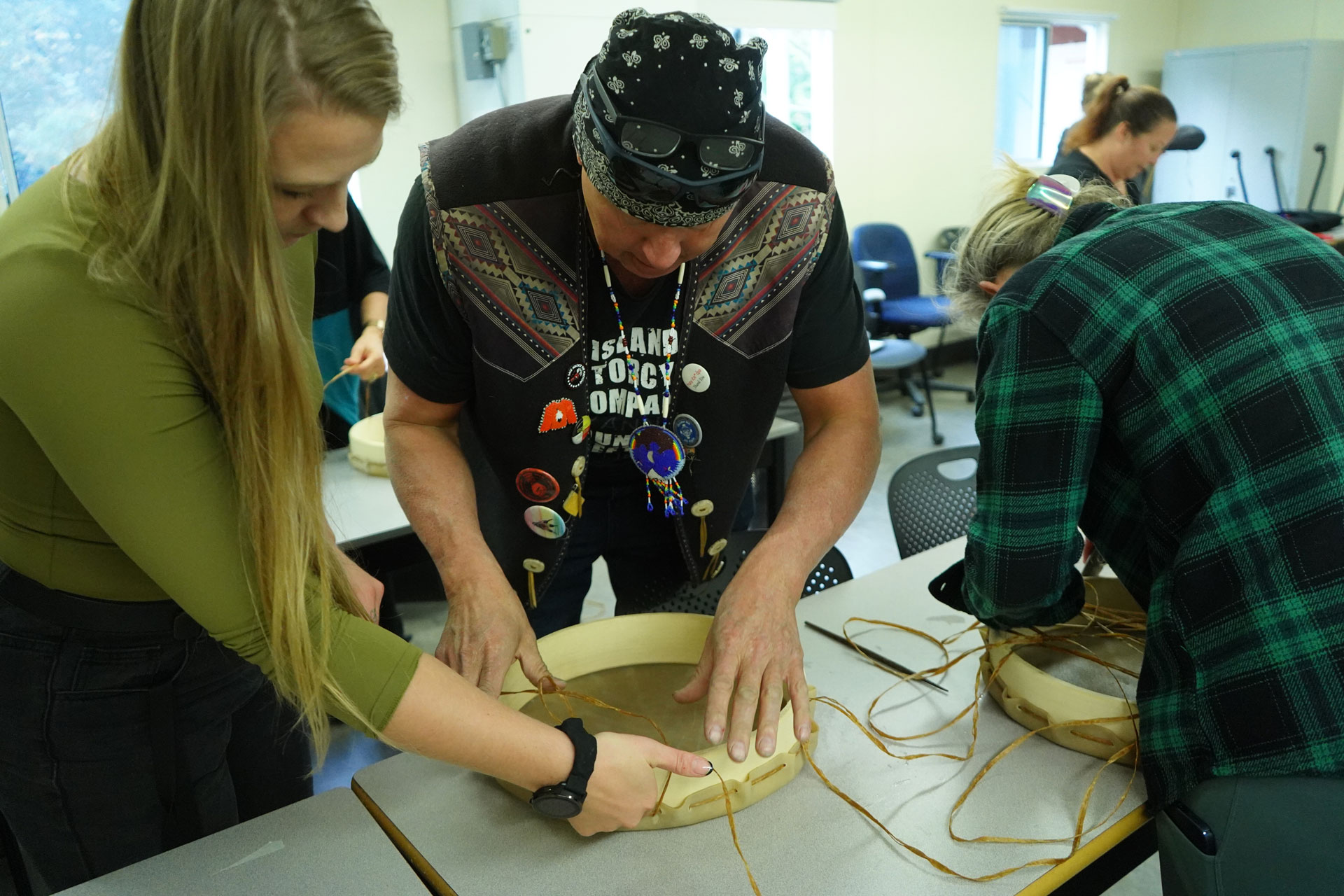Daryle Mills leading a drum making workshop for staff and students