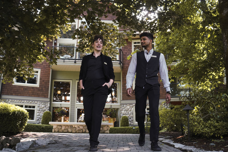 Two students walk the grounds of their work placement in hospitality industry