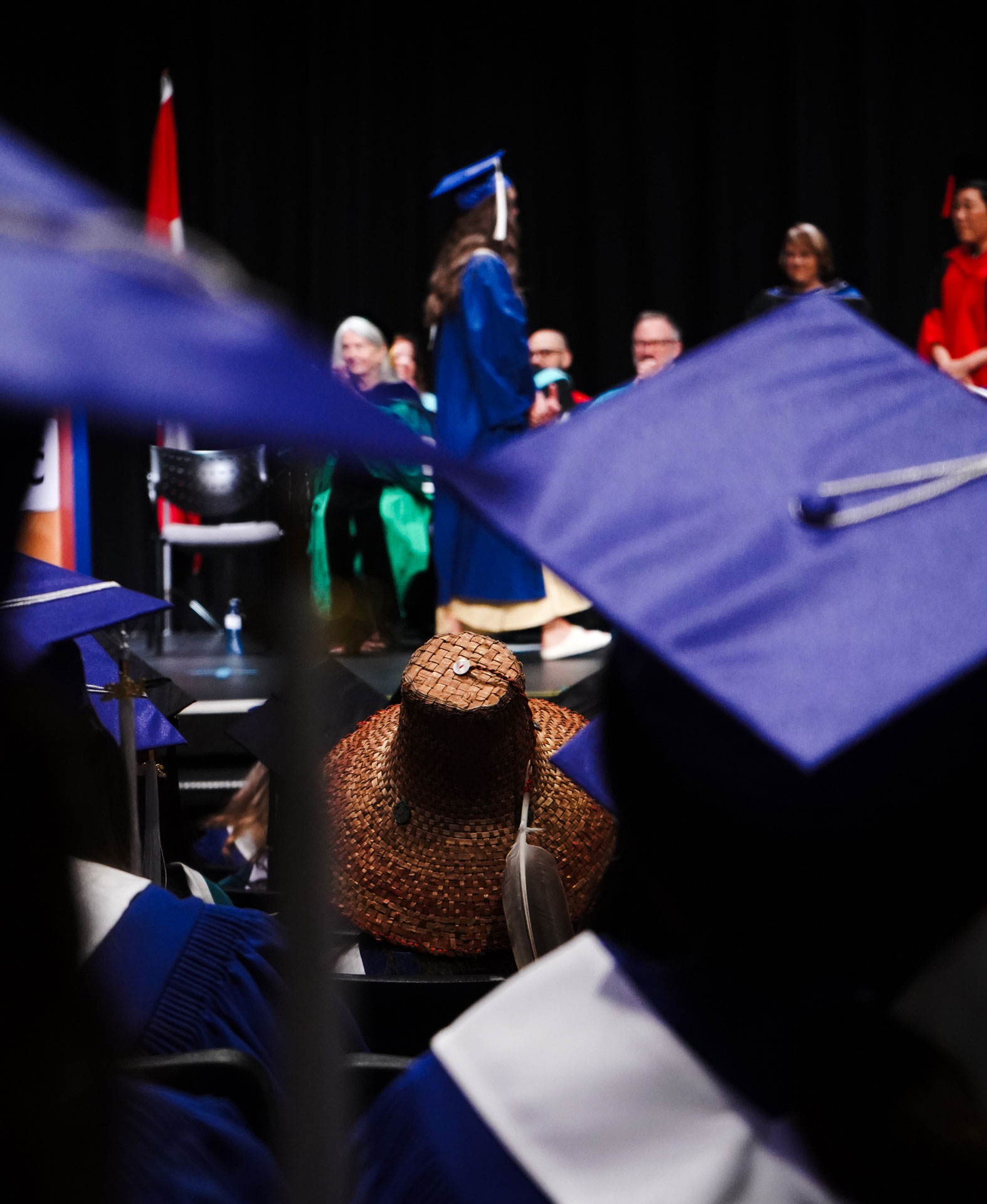 A graduate with woven cedar regalia at Comox Valley convocation ceremony