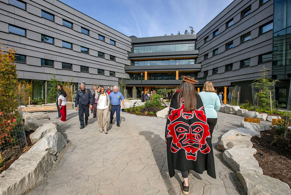 Guests visit North Island College's housing at opening event.