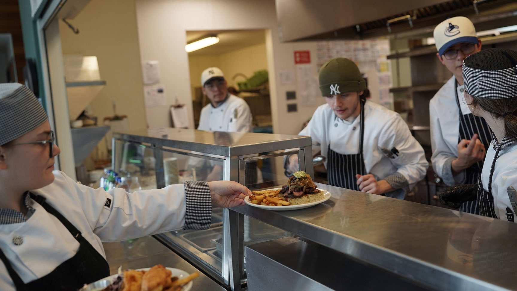 Culinary students serve lunch at a college