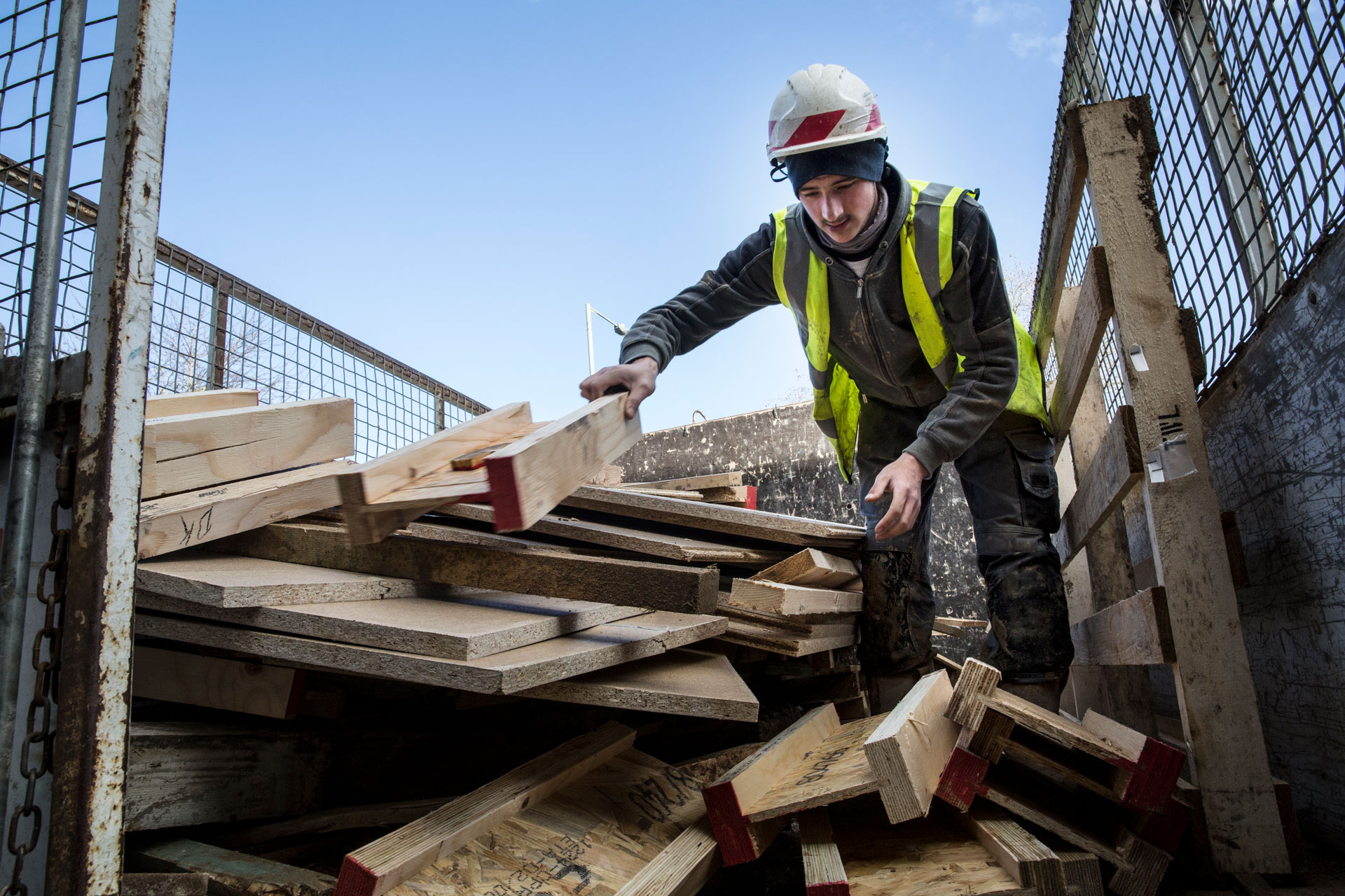 Person sorting salvaged wood